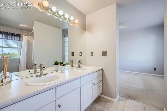 bathroom with tile patterned floors and vanity