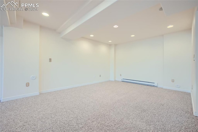 basement with carpet and a baseboard heating unit