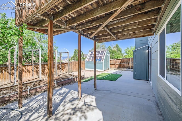 view of patio featuring a storage shed