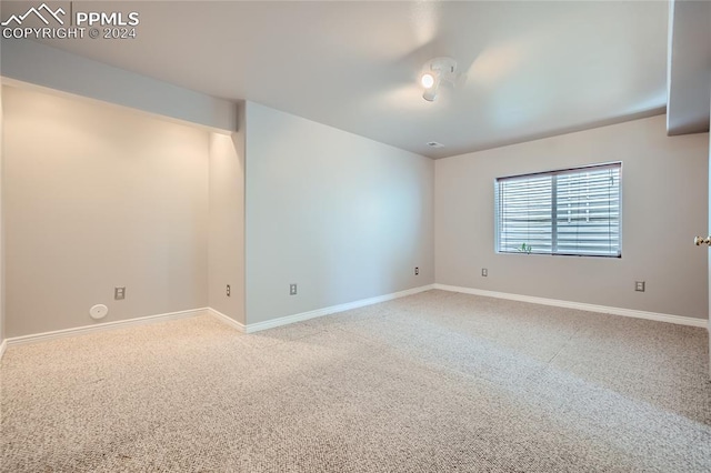 empty room with light colored carpet