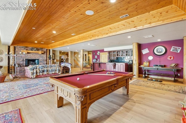 playroom featuring a fireplace, light hardwood / wood-style flooring, wooden ceiling, and billiards