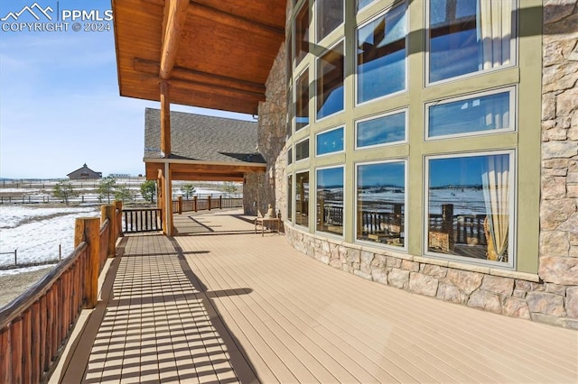 view of snow covered deck