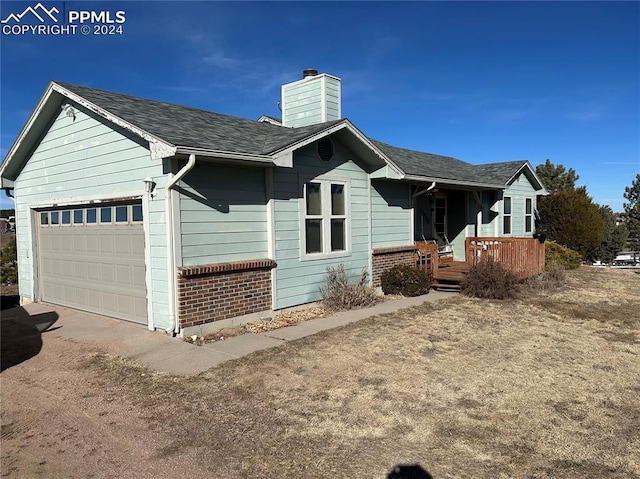 view of front of property with a garage