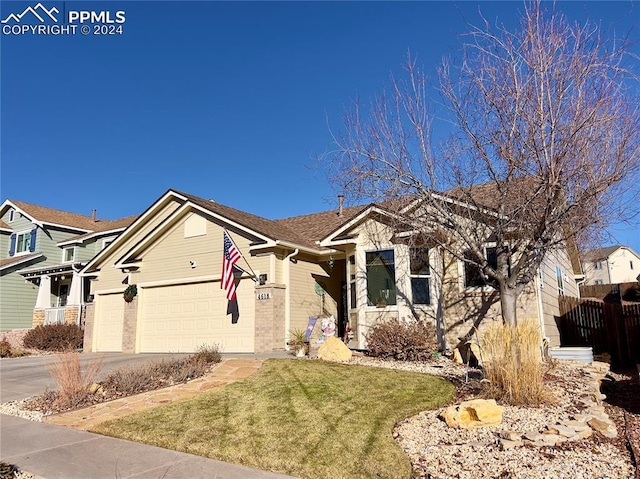 view of front of property with a front lawn and a garage