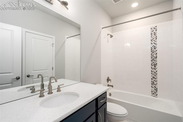 full bathroom featuring vanity, shower / bath combination, and toilet