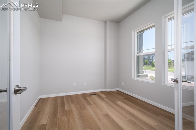 unfurnished room featuring light wood-type flooring