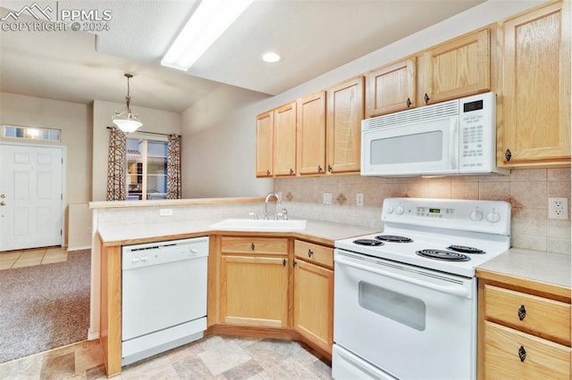 kitchen featuring light colored carpet, white appliances, sink, and light brown cabinetry