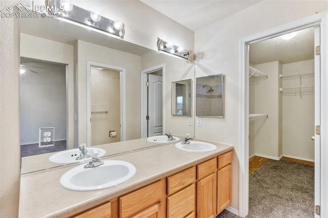 bathroom with vanity and ceiling fan