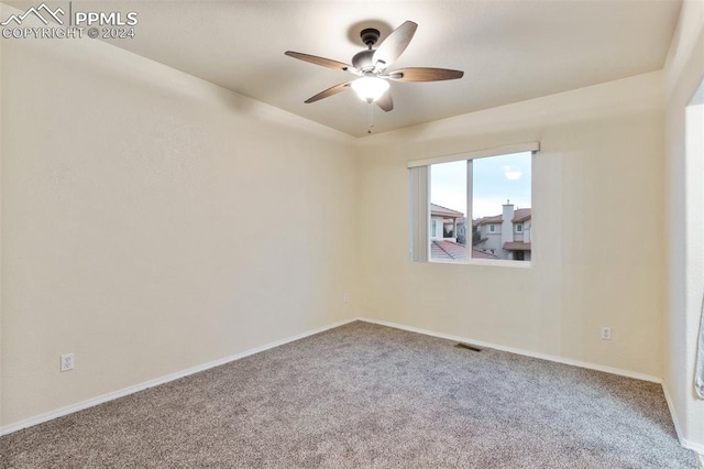 empty room with carpet and ceiling fan