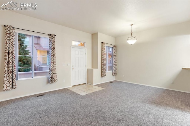 empty room with light colored carpet