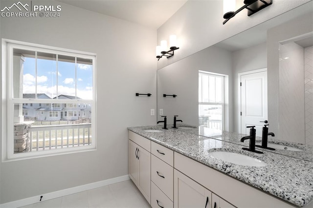 bathroom with tile patterned flooring and vanity