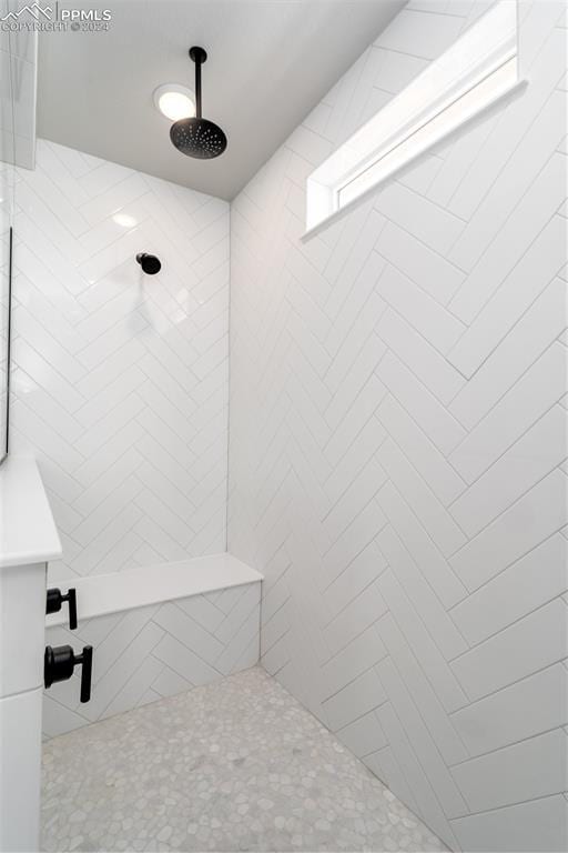 bathroom with a tile shower