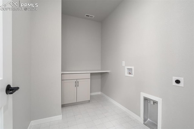 laundry room featuring cabinets, washer hookup, and hookup for an electric dryer