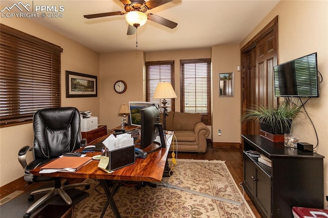 office with ceiling fan and dark hardwood / wood-style floors