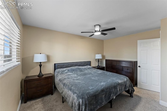 carpeted bedroom with ceiling fan