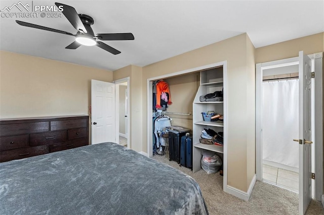 carpeted bedroom featuring a closet and ceiling fan