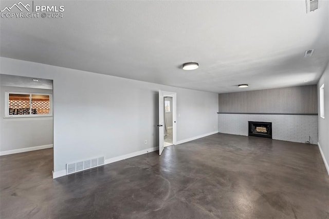 unfurnished living room featuring a fireplace