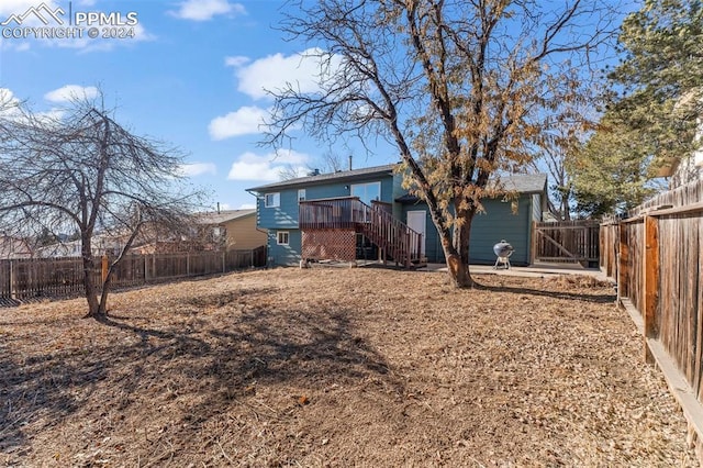 back of house featuring a deck