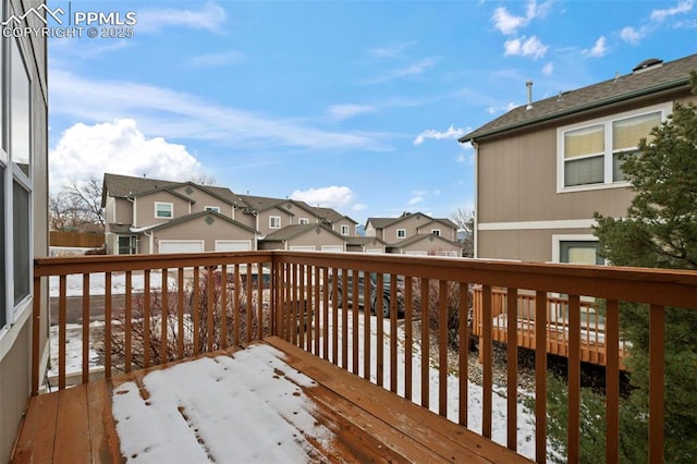 view of snow covered deck