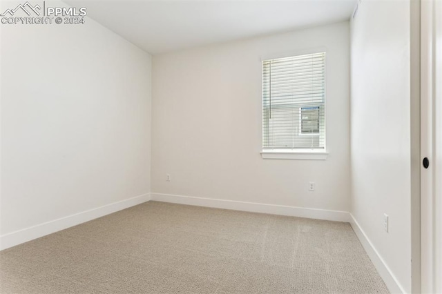 spare room with carpet flooring