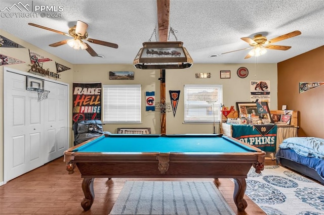 game room featuring ceiling fan, hardwood / wood-style flooring, a textured ceiling, and pool table