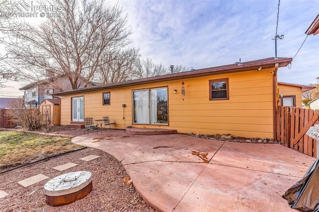 back of property with a patio area