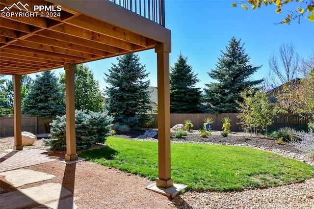 view of yard featuring a patio and a deck