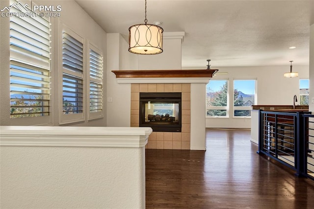 interior space featuring beverage cooler, dark wood-type flooring, and sink