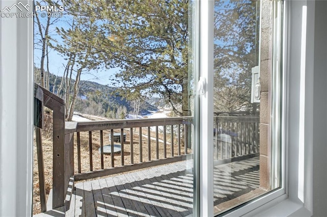 wooden terrace with a mountain view