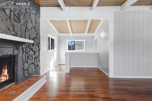 hallway with dark hardwood / wood-style flooring, wood ceiling, and beamed ceiling