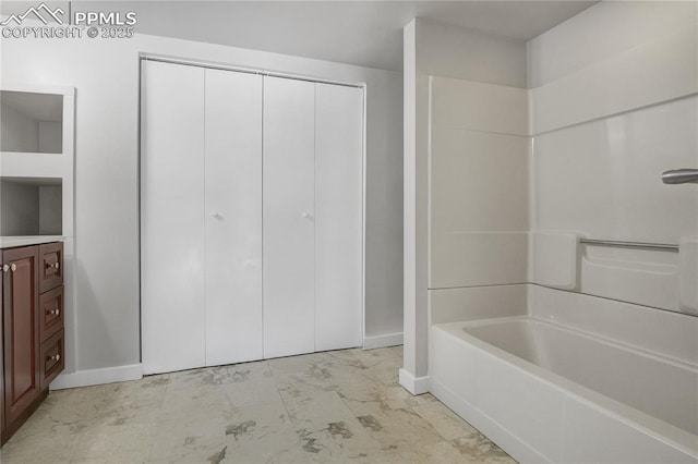 bathroom with washtub / shower combination and vanity