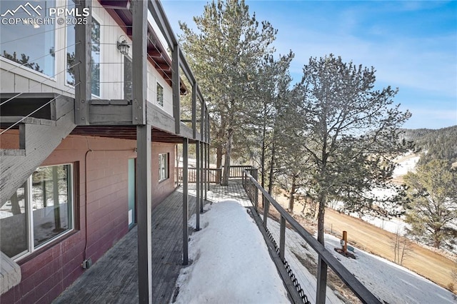 view of side of home with a balcony