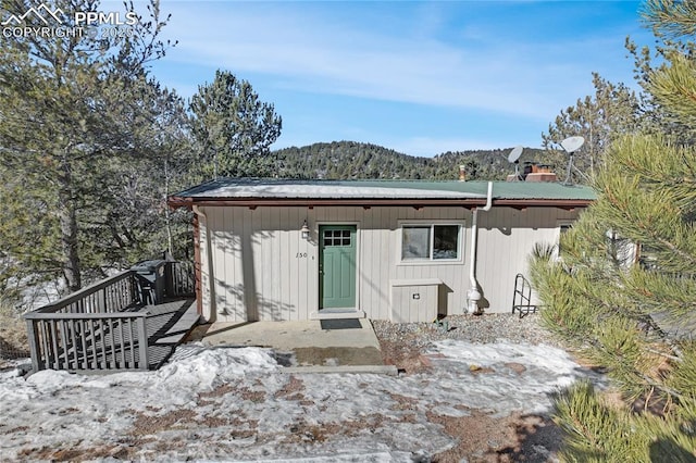 back of house with a mountain view