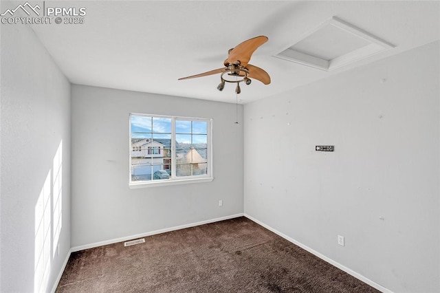 carpeted spare room featuring ceiling fan