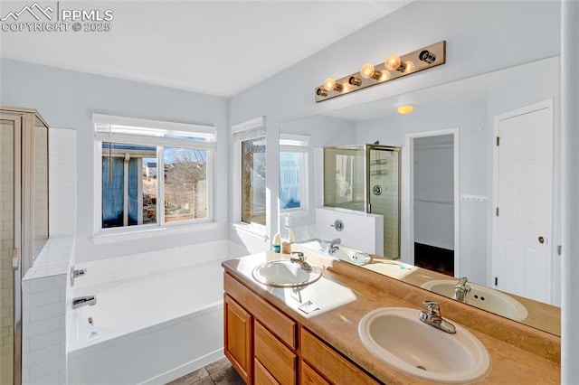 bathroom with tile patterned flooring, vanity, and independent shower and bath