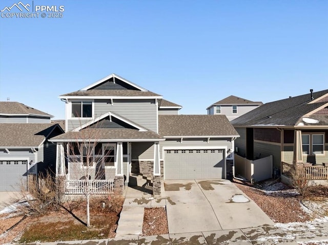 view of front of home featuring a porch and a garage