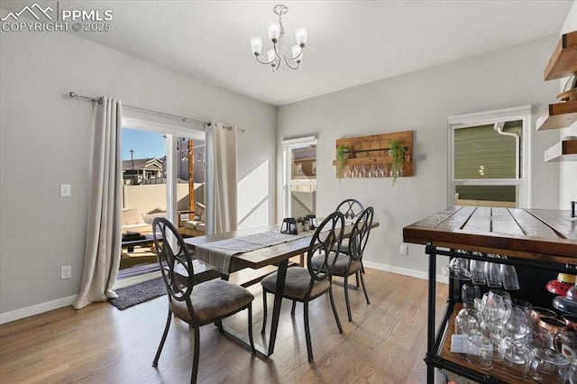 dining space featuring a chandelier and hardwood / wood-style flooring