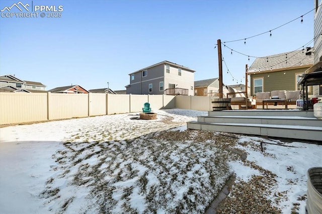 yard covered in snow featuring an outdoor hangout area and a deck