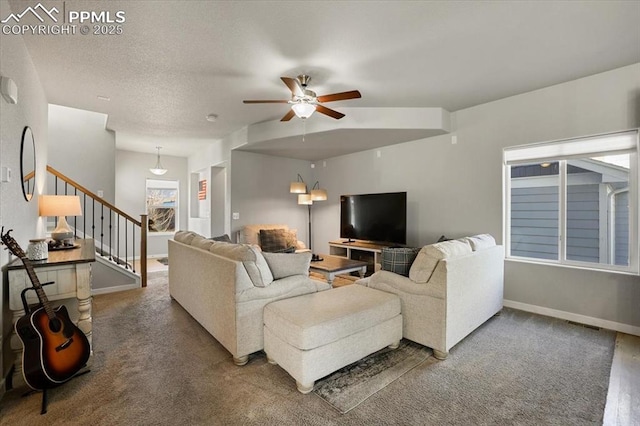 carpeted living room featuring ceiling fan