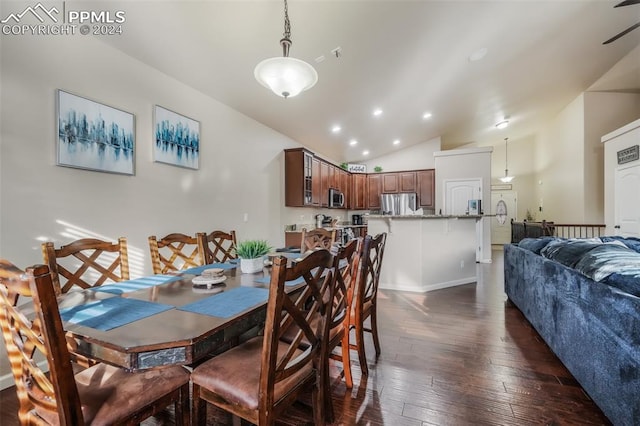 dining area featuring dark hardwood / wood-style flooring and lofted ceiling