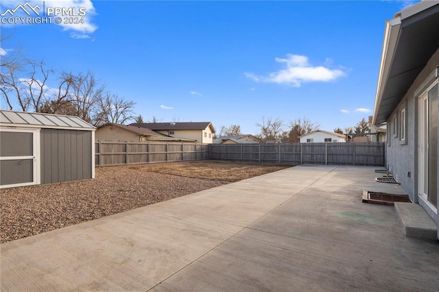 view of patio / terrace with a storage unit