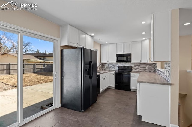 kitchen with recessed lighting, tasteful backsplash, black appliances, and white cabinetry