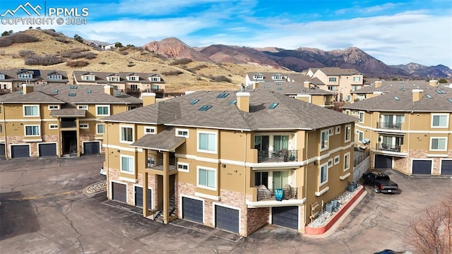 exterior space featuring a mountain view and a garage