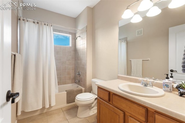 full bathroom featuring tile patterned flooring, vanity, toilet, and shower / bathtub combination with curtain