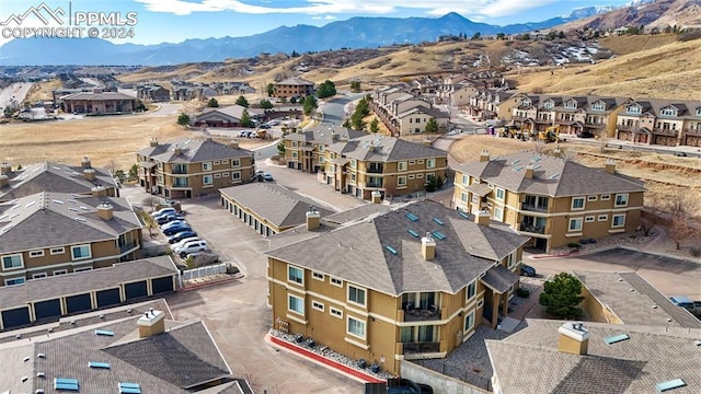 birds eye view of property with a mountain view