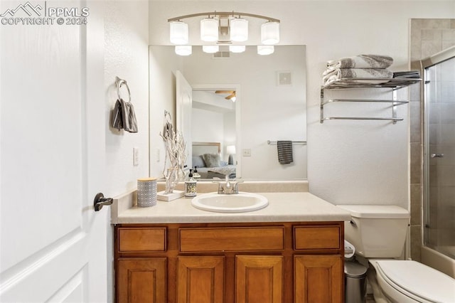 full bathroom featuring vanity, toilet, and combined bath / shower with glass door