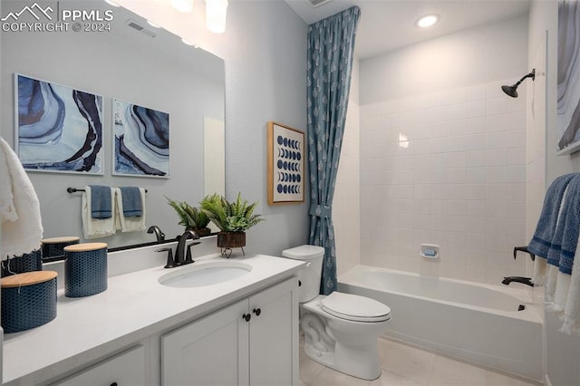 full bathroom with tile patterned flooring, shower / bath combination with curtain, vanity, and toilet