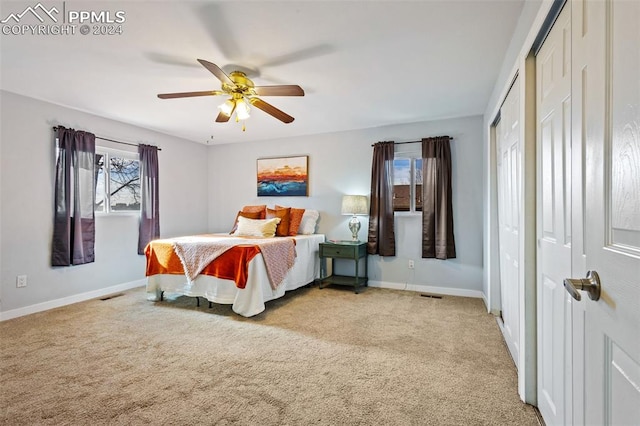 carpeted bedroom featuring ceiling fan