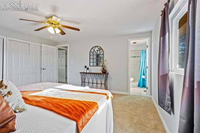 carpeted bedroom with connected bathroom and ceiling fan