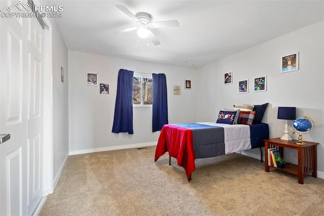 carpeted bedroom featuring ceiling fan